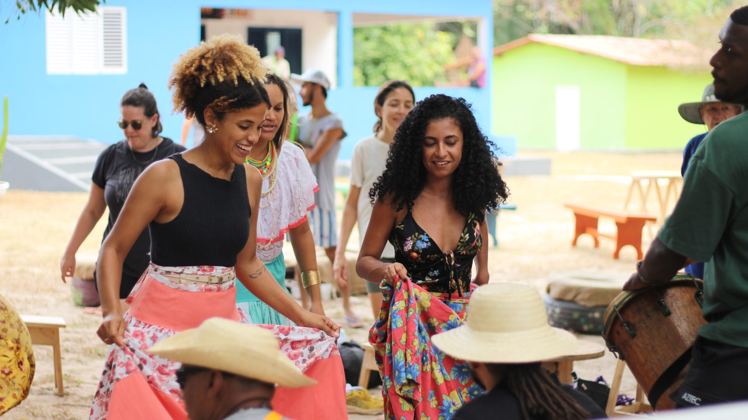 Afro indigenous hosts of Cazumbada perform a dance.